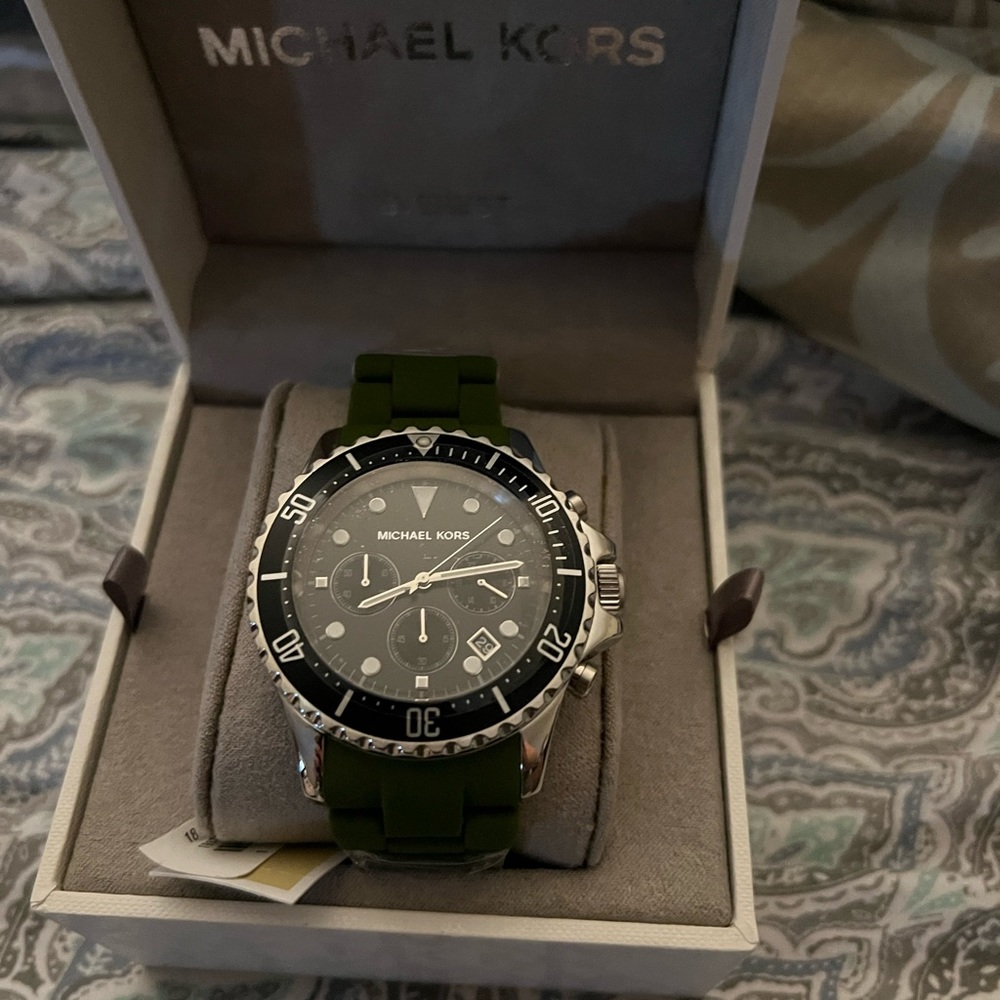 New with tag. Micheal Kors watch. Green and silver band
